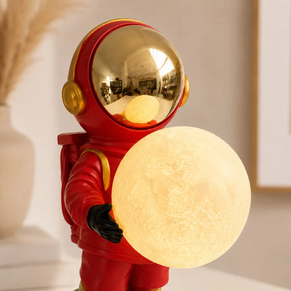 Closeup of astronaut helmet and moon in decorative lamp