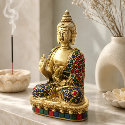 Side view of Brass Buddha with stone inlay detailing