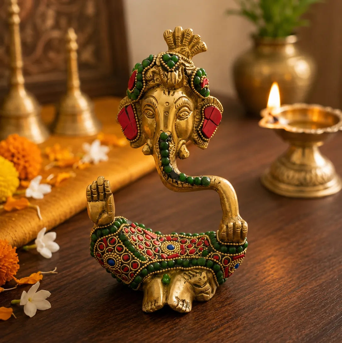 Closeup of colorful stone work and detailed carving on Ganesh Ji Idol