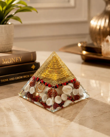 Closeup of Gomti Chakras, rudraksha and gold in Laxmi Orgone Pyramid
