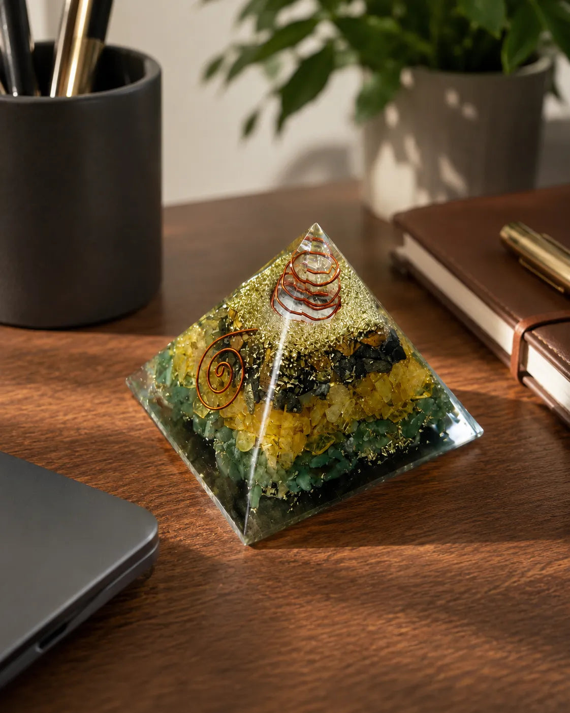 Closeup of green yellow crystals and copper coil in Money Magnet Pyramid