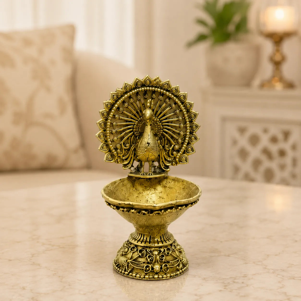 Closeup of intricate peacock design on Brass Diya