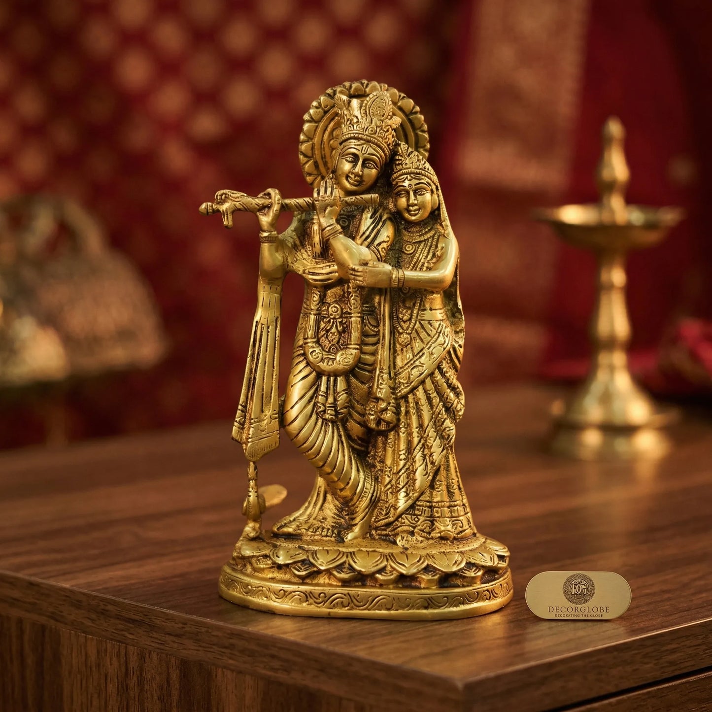 Intricate carving and golden brass finish on Radha Krishna Idol