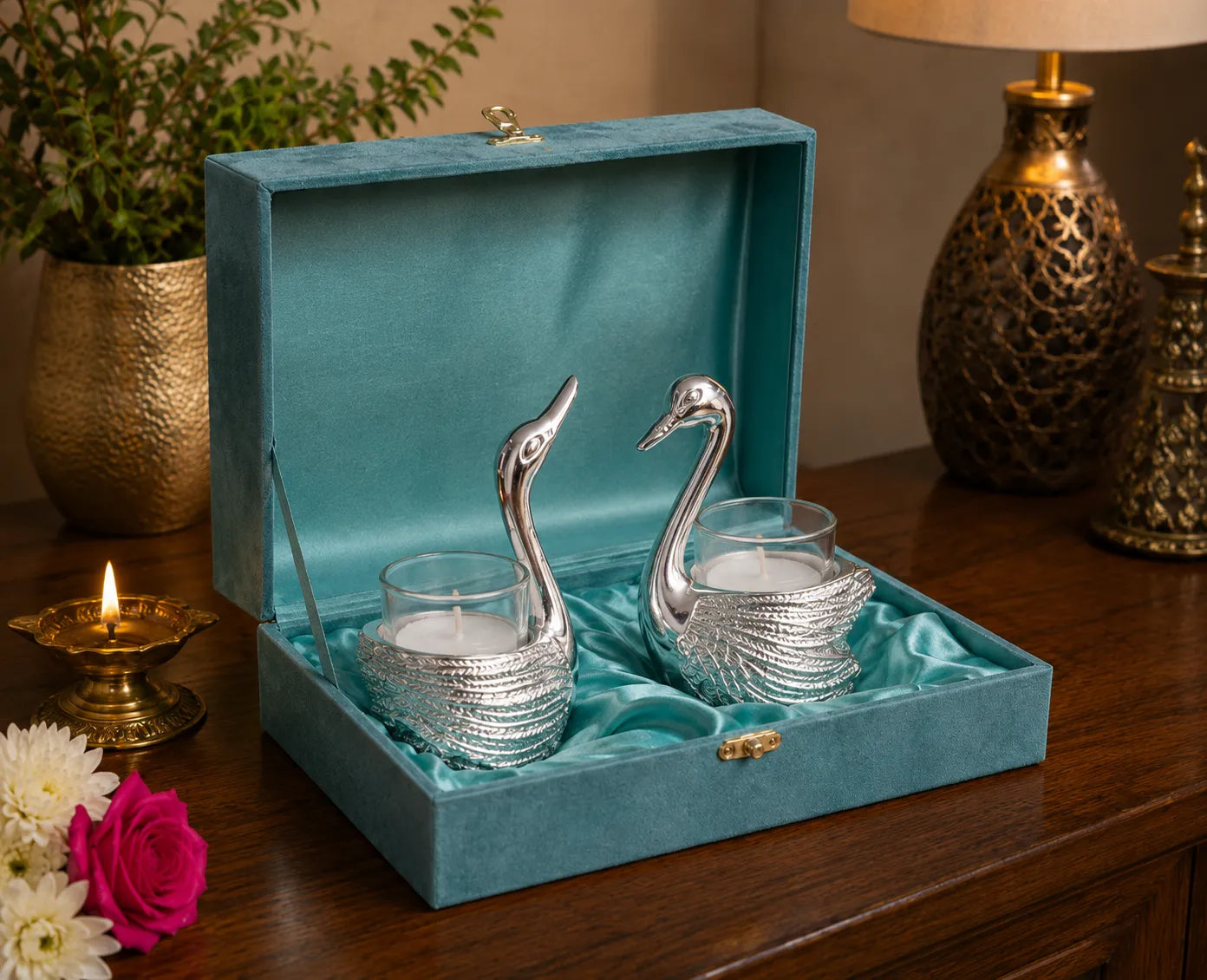 Closeup of detailed silver swan candle holder design