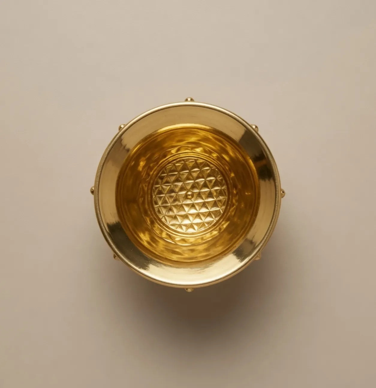Closeup of ultra fine engraving on brass kalash